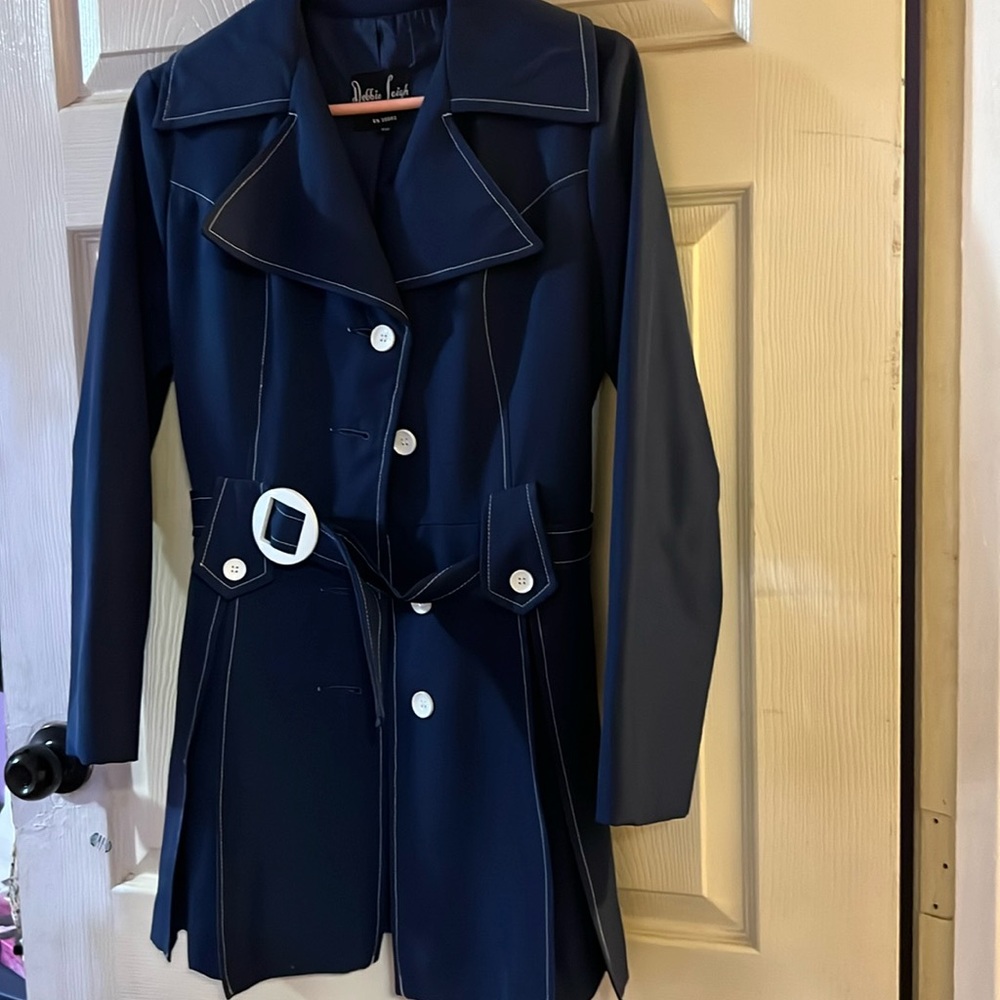 This is a very cute jacket , fits very nice. Has pleats